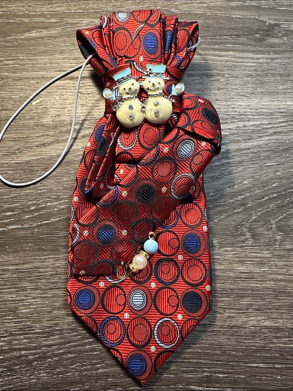 Festive Red Patterned Necklace Tie with Snowman Accent